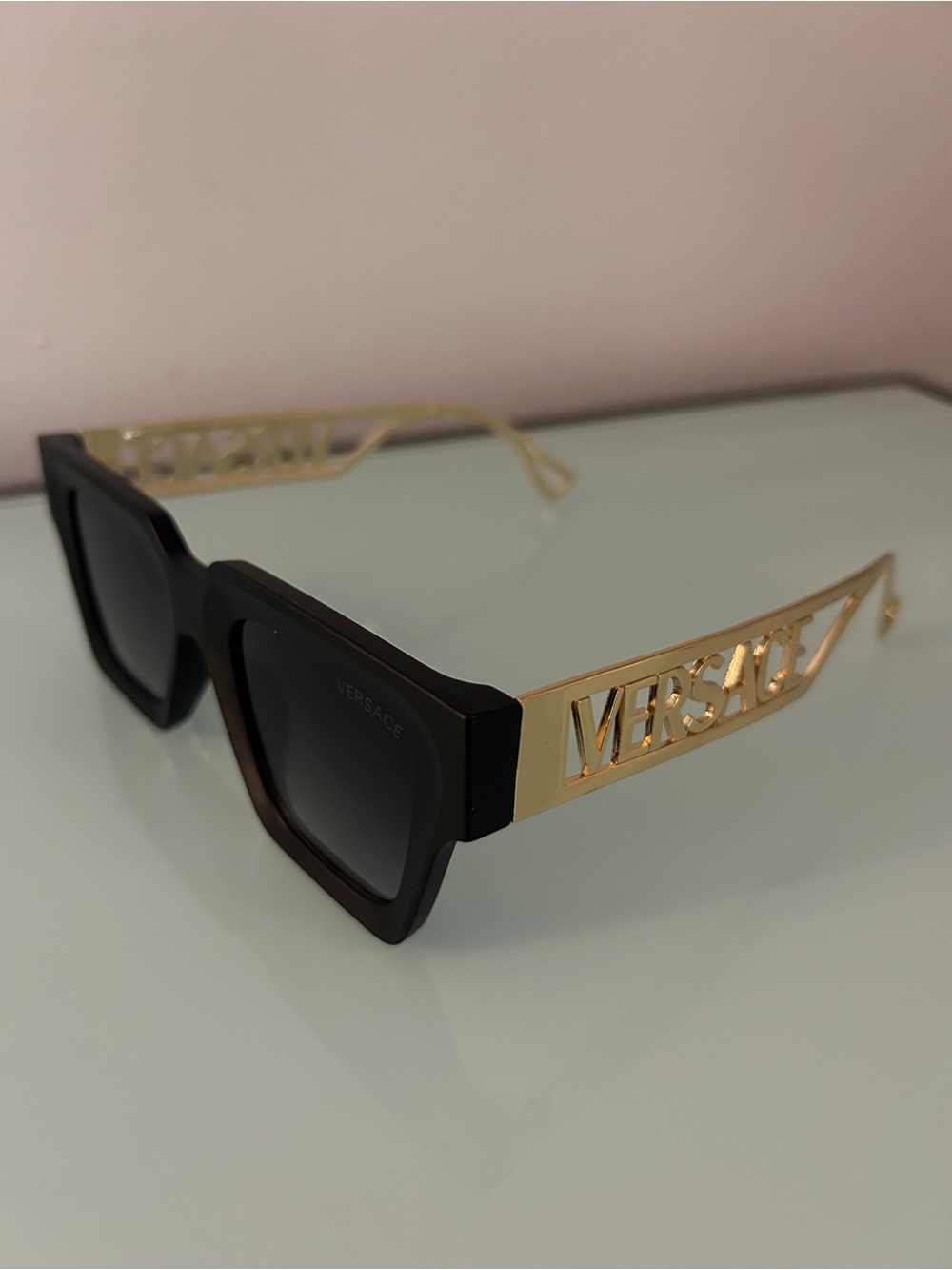 Versace Black Frame Sunglasses with Gold Logo Temples